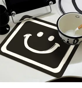 Minimalist kitchen draining mat, black and white silicone diatomaceous earth absorbent pad.