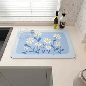 Absorbent kitchen drying mat with fresh daisy floral print, non-slip heat insulation table pad.