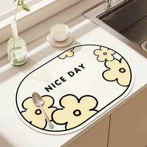 Modern kitchen countertop draining mat, absorbent non-slip tech cloth mat with floral design.