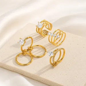 Gold stainless steel multi-band cubic zirconia ring detail shot, stylish stackable design.