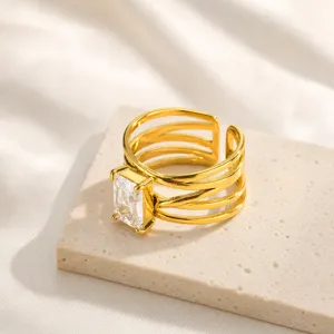 Detail view of the multi-band gold stainless steel ring with emerald-cut cubic zirconia.