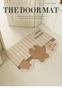 Cute cartoon bear door mat detail showing loop wire texture, non-slip scraper for home hallway.