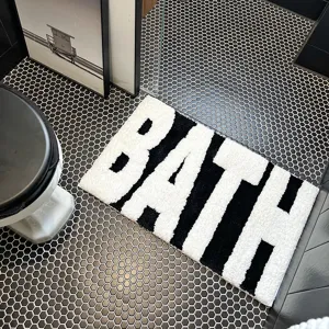 Nordic black white tufted bath mat, absorbent bathroom floor rug with bold letter design.
