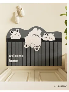 Door mat detail showing cute cartoon animal design and durable coil texture for entryways.