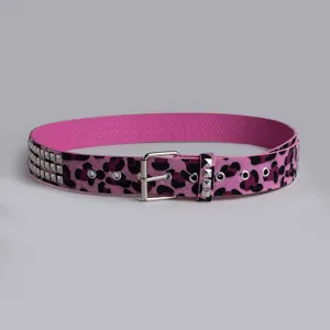 Pink leopard print belt detail featuring square metal rivets, eyelets, and silver buckle.