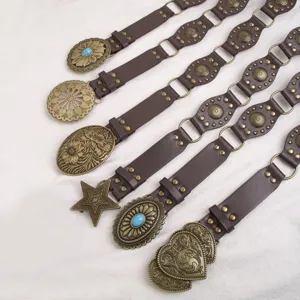 Detail view of retro western style women leather belt with vintage carved buckles.