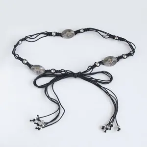 Bohemian style woven waist belt with metal discs and beads for summer vacation detail.