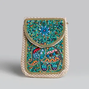 Bohemian beaded straw phone bag detail, ethnic elephant pattern crossbody pouch for vacation.