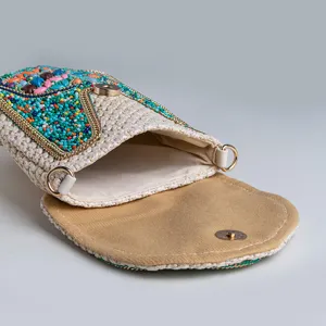 Bohemian beaded straw phone bag with turquoise and ethnic crossbody design for holiday.