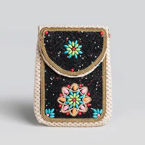 Bohemian style straw woven phone bag with colorful rice beads and turquoise floral design.