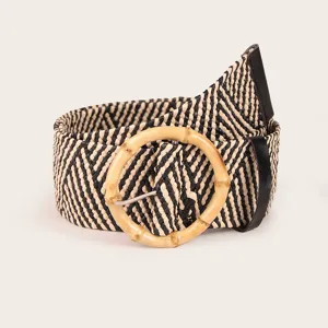 Close-up detail of the black and white woven belt with unique round bamboo buckle design.