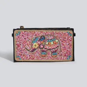 Detailed shot of bohemian style beaded elephant clutch bag with colourful PU leather craftsmanship.