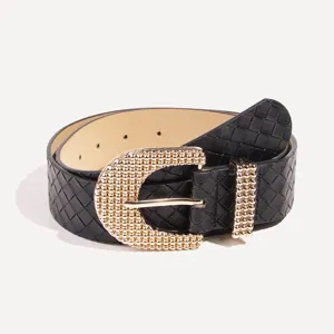 Women black woven leather belt with gold rhinestone ornate buckle fashion accessory.
