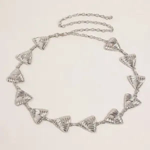 Silver metal waist chain detail, retro carved triangle design, fashionable belt accessory.