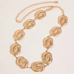 Gold metal waist chain featuring vintage carved round links and adjustable link chain.