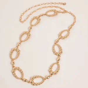 Detailed view of the retro gold carved metal oval link chain belt design and fine texture.