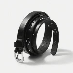 Women thin studded faux leather belt casual detail view showing metal buckle and eyelets.