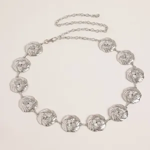 Silver metallic waist chain for women with intricate round woven discs and adjustable link.