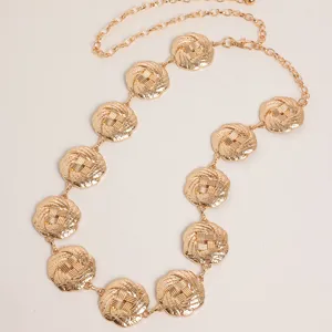 Vintage gold metal waist chain for women, retro carved round flower links, stylish belt accessory.