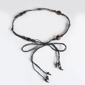 Bohemian braided waist belt with wooden beads, stylish boho accessory for women casual wear.