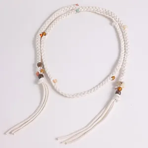 Bohemian woven waist rope detail, beige cotton cord with colorful beads and chic tassels.