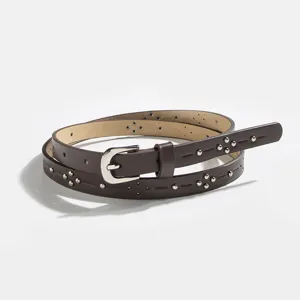 Women's brown faux leather belt featuring chic metal studs and delicate cutouts for daily wear.