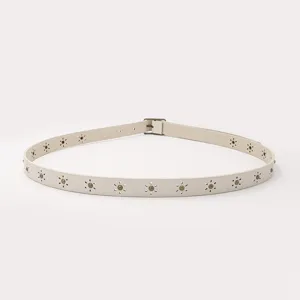Women's slim faux leather casual belt with hollow star studs and vintage metal buckle detail.
