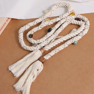 Bohemian woven rope belt with colorful beads and chic tassels, soft cotton fabric style.