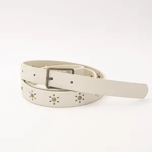 Women's casual thin faux leather belt with floral cutouts and metal studs for daily wear.