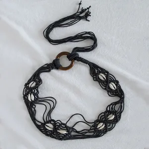 Bohemian handmade black wax rope woven belt with white shells and round wooden ring buckle.