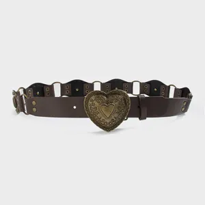 Retro brown western style leather belt with carved heart buckle and metal rings detail.