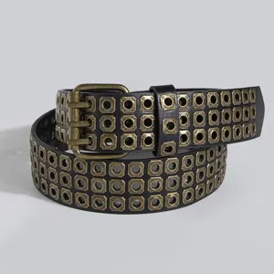 Punk style black women belt with square metal eyelets and bronze double prong buckle detail.