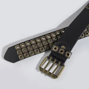 Close-up detail of the black punk leather belt featuring antique bronze metal buckle.
