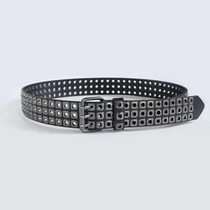 Punk style women belt with multi row square eyelets and distressed metal buckle for daily wear.