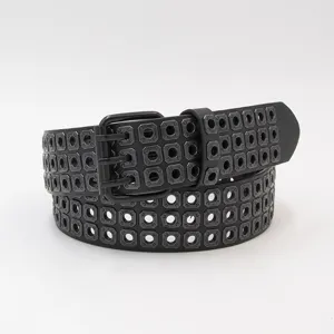 Punk style women leather belt with square metal eyelets and triple pin buckle detail.