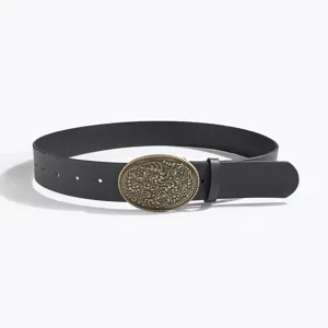 Western vintage engraved women's leather belt with ornate oval metal buckle in classic black.
