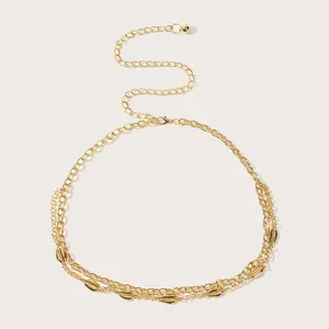 Gold layered waist chain with shell pendants, bohemian body jewelry for women detail view.