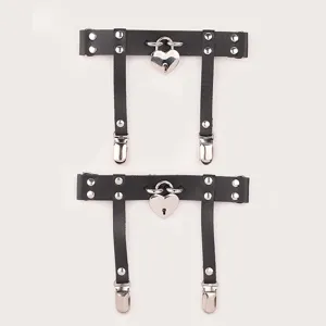 Detail shot of black PU leather leg garter ring with heart lock and metal clips, adjustable fit.