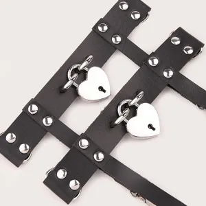 Black gothic leather leg garter with metal studs and heart padlock for stylish women.