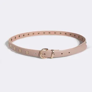 Pink thin leather belt detail featuring gold metal buckle, square studs and eyelet holes.