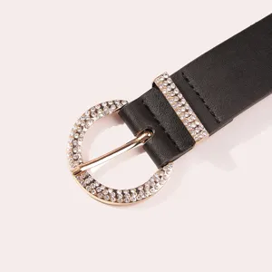Women fashion black leather belt with sparkling rhinestone round buckle detail accessory.