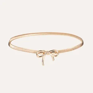 Gold bow waist chain detail view, elegant metallic finish and delicate bowknot design.