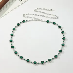 Elegant silver tone metal waist chain featuring sparkling green rhinestone crystal details
