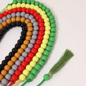 Detailed close-up of colorful beaded tassel waist rope, vibrant bohemian style accessory.