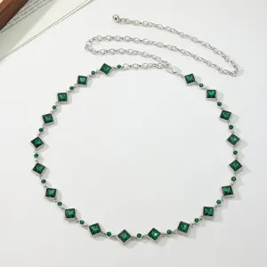 Elegant women's rhinestone chain belt featuring green crystal square gems and silver links.