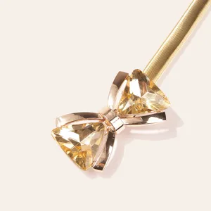 Elegant women's gold spring waist chain featuring sparkling rhinestone bow buckle.