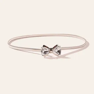 Elegant rhinestone crystal bow metal spring waist chain detail, fashion women dress belt accessory.