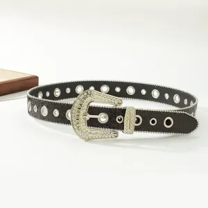 Black rhinestone western belt detail showing sparkling crystal buckle and metal eyelets.