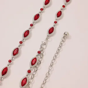 Close-up detail of women silver waist chain featuring red marquise cut crystals and adjustable link.