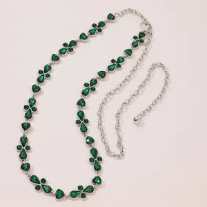 Elegant women waist chain featuring sparkling green crystal stones and silver tone metal links.